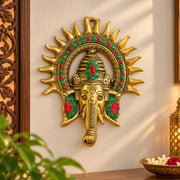 KRIDAY Kraft Kiran Ganesha Wall Hanging, 22 cm Ganpati Idol with Surya Chakra and Red-Green Stone Work, Gold Finish Wall Décor for Home Entrance, Pooja Room, Living Room and Housewarming Gift