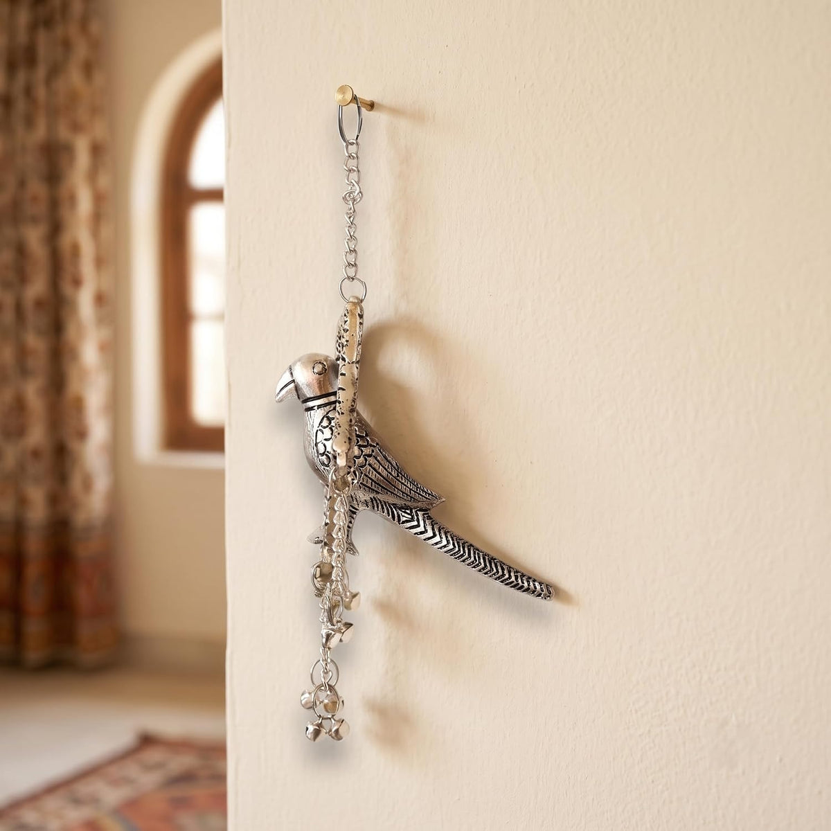 KridayKraft Silver Plated Tikona Parrot Metal Hanging Décor with Chains and Bells | Traditional Indian Wall Hanging Showpiece for Living Room, Home Entrance & Vastu (22 cm x 12 cm)