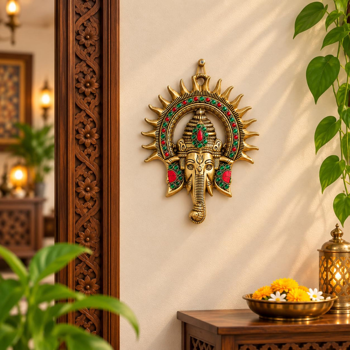KRIDAY Kraft Kiran Ganesha Wall Hanging, 22 cm Ganpati Idol with Surya Chakra and Red-Green Stone Work, Gold Finish Wall Décor for Home Entrance, Pooja Room, Living Room and Housewarming Gift