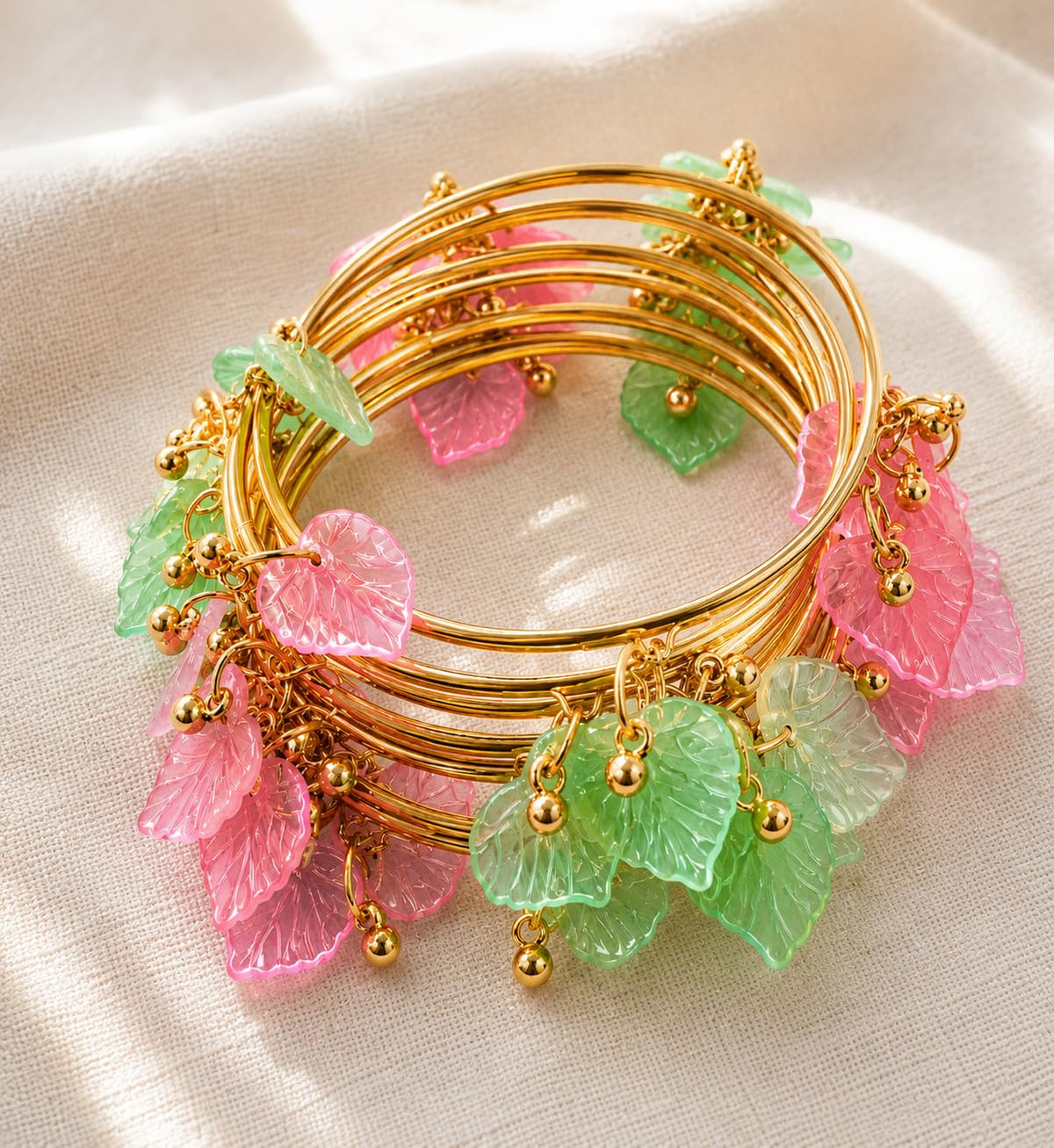 NMII Gold Plated Multicolor Leaf Ghunghroo Bangles Set | Pink & Green Leaf Design Kangan | Designer Gold Finish Metal Chudi | Stylish Floral Chudiya For Wedding Festive - Set Of 8