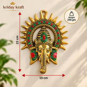 KRIDAY Kraft Kiran Ganesha Wall Hanging, 22 cm Ganpati Idol with Surya Chakra and Red-Green Stone Work, Gold Finish Wall Décor for Home Entrance, Pooja Room, Living Room and Housewarming Gift