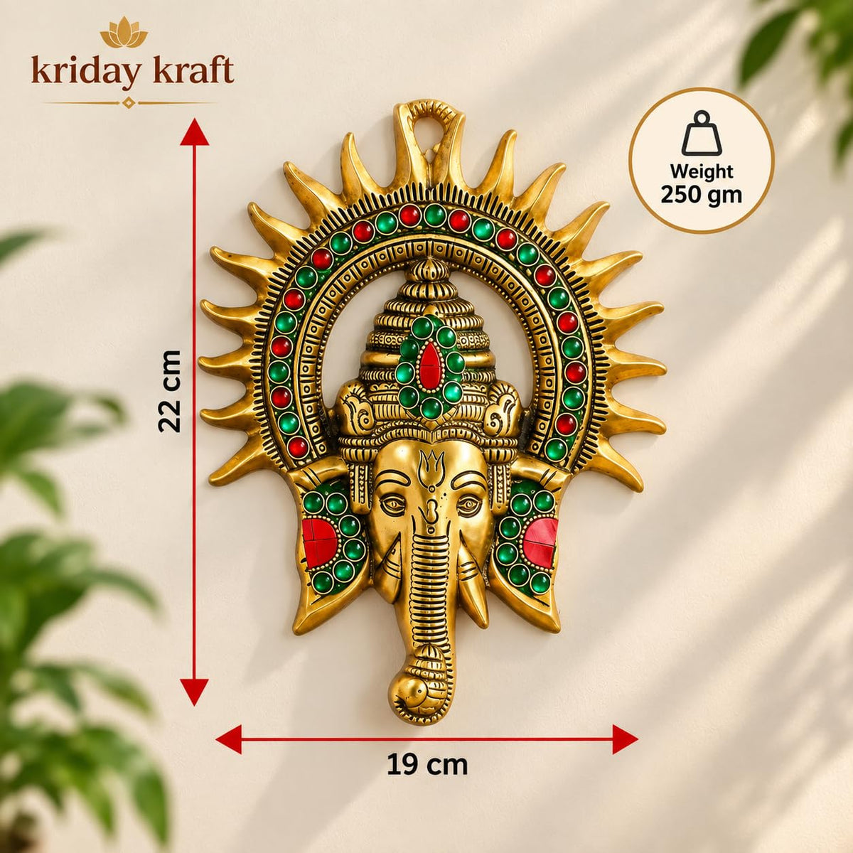 KRIDAY Kraft Kiran Ganesha Wall Hanging, 22 cm Ganpati Idol with Surya Chakra and Red-Green Stone Work, Gold Finish Wall Décor for Home Entrance, Pooja Room, Living Room and Housewarming Gift