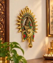 KRIDAY Kraft Kiran Ganesha Wall Hanging, 22 cm Ganpati Idol with Surya Chakra and Red-Green Stone Work, Gold Finish Wall Décor for Home Entrance, Pooja Room, Living Room and Housewarming Gift