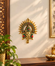 KRIDAY Kraft Kiran Ganesha Wall Hanging, 22 cm Ganpati Idol with Surya Chakra and Red-Green Stone Work, Gold Finish Wall Décor for Home Entrance, Pooja Room, Living Room and Housewarming Gift