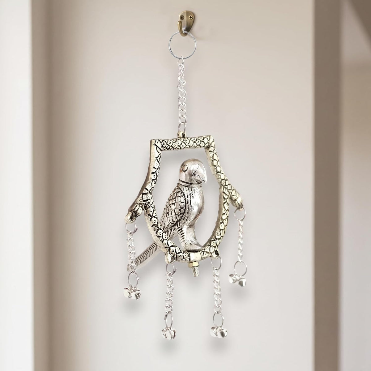 KridayKraft Silver Plated Tikona Parrot Metal Hanging Décor with Chains and Bells | Traditional Indian Wall Hanging Showpiece for Living Room, Home Entrance & Vastu (22 cm x 12 cm)