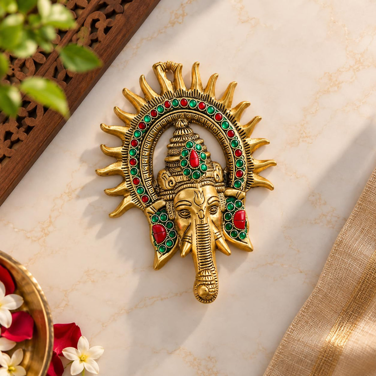 KRIDAY Kraft Kiran Ganesha Wall Hanging, 22 cm Ganpati Idol with Surya Chakra and Red-Green Stone Work, Gold Finish Wall Décor for Home Entrance, Pooja Room, Living Room and Housewarming Gift