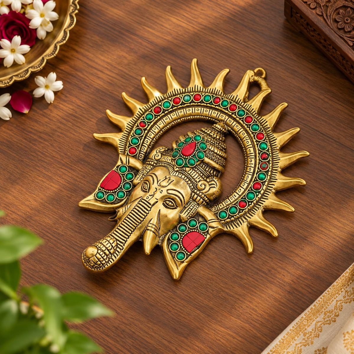 KRIDAY Kraft Kiran Ganesha Wall Hanging, 22 cm Ganpati Idol with Surya Chakra and Red-Green Stone Work, Gold Finish Wall Décor for Home Entrance, Pooja Room, Living Room and Housewarming Gift
