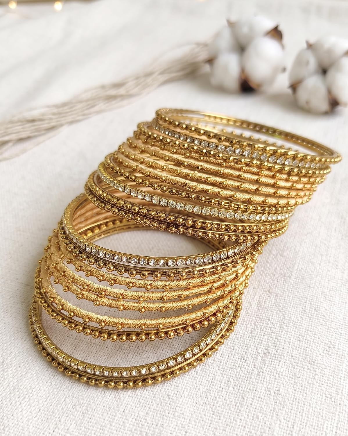 NMII Non-Precious Metal with Base Metal and Zircon Gemstone Studded Ball Chain Linked Glossy Finished Silk thread Bangle set for Women and Girls